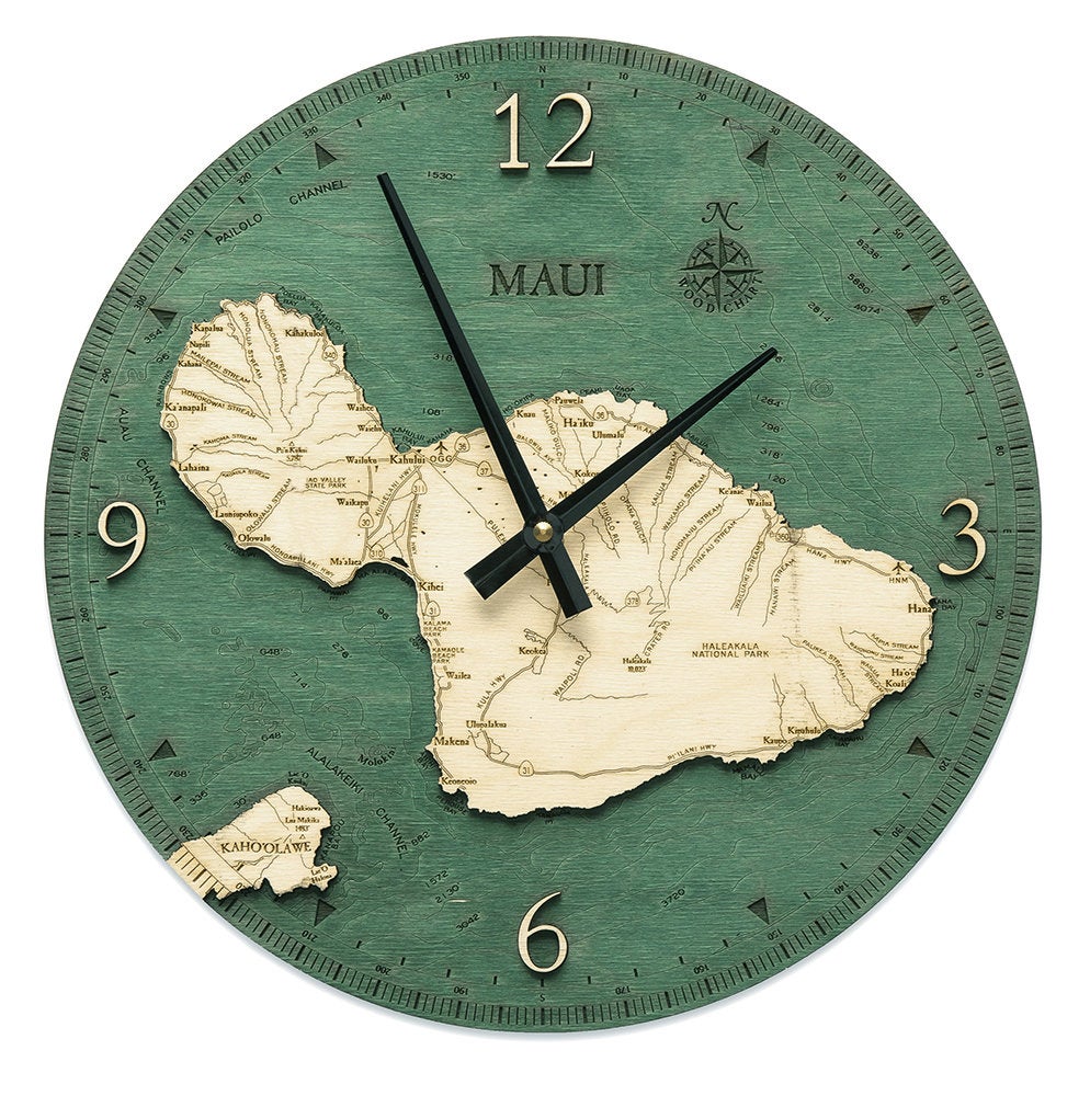 Maui, Hawaii wood wall clock in laser-cut Baltic birch, shown framed against a light wall