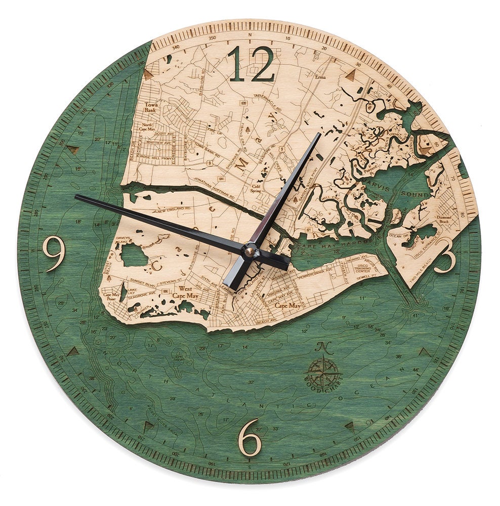Cape May, New Jersey wood wall clock in laser-cut Baltic birch, shown framed against a light wall