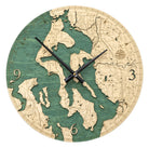 Whidbey & Camano Islands, Washington wood wall clock in laser-cut Baltic birch, shown framed against a light wall