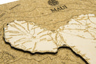 Maui, Hawaii framed cork map in laser-cut Baltic birch, shown framed against a light wall
