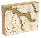 Lake Charlevoix, Michigan framed cork map in laser-cut Baltic birch, shown framed against a light wall