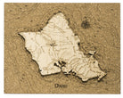 Oahu, Hawaii framed cork map in laser-cut Baltic birch, shown framed against a light wall