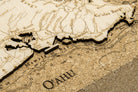 Oahu, Hawaii framed cork map in laser-cut Baltic birch, shown framed against a light wall