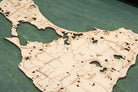 Block Island, Rhode Island wood serving tray in laser-cut Baltic birch, shown framed against a light wall