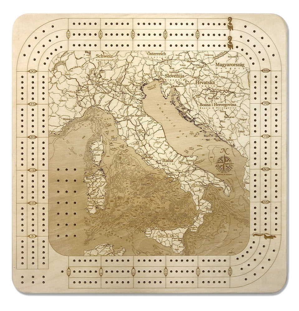 Italy wood cribbage board in laser-cut Baltic birch, shown framed against a light wall