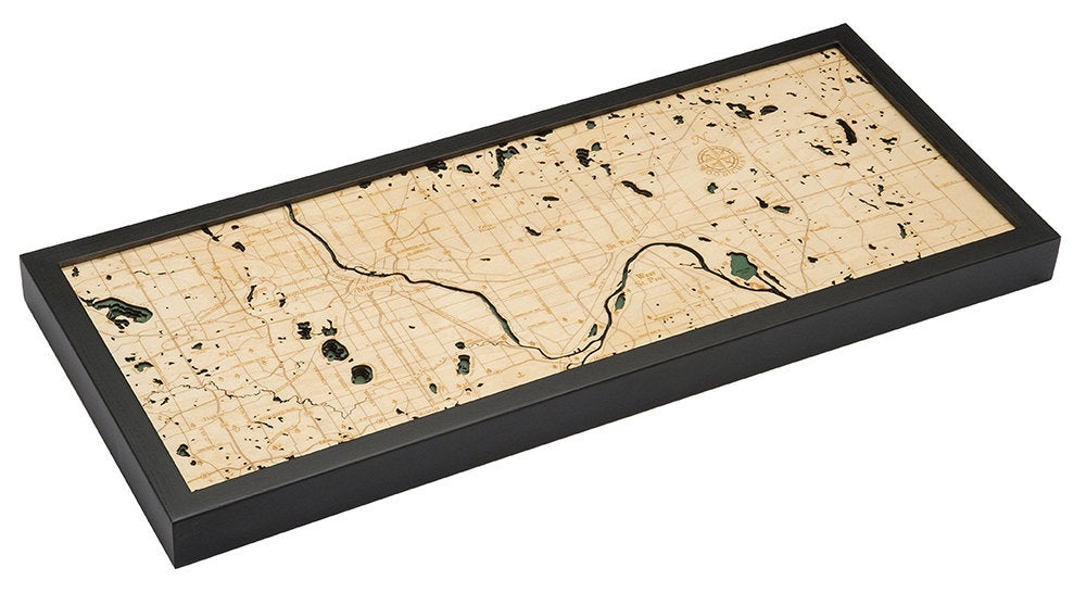 Minneapolis & St. Paul, Minnesota 3D layered wood map in laser-cut Baltic birch, shown framed against a light wall