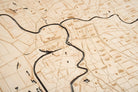 Sacramento, California 3D layered wood map in laser-cut Baltic birch, shown framed against a light wall