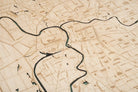 Sacramento, California 3D layered wood map in laser-cut Baltic birch, shown framed against a light wall