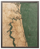 Jacksonville, Florida 3D layered wood map in laser-cut Baltic birch, shown framed against a light wall