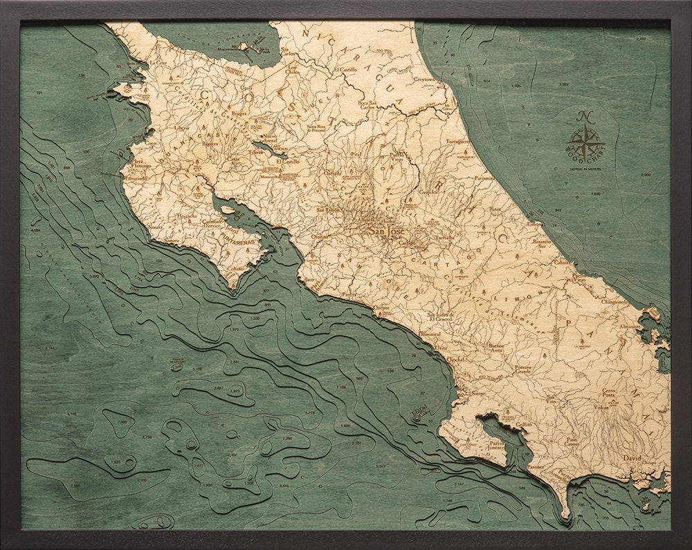 Costa Rica 3D layered wood map in laser-cut Baltic birch, shown framed against a light wall
