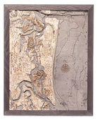 Amelia Island, Florida 3D layered wood map in laser-cut Baltic birch, shown framed against a light wall