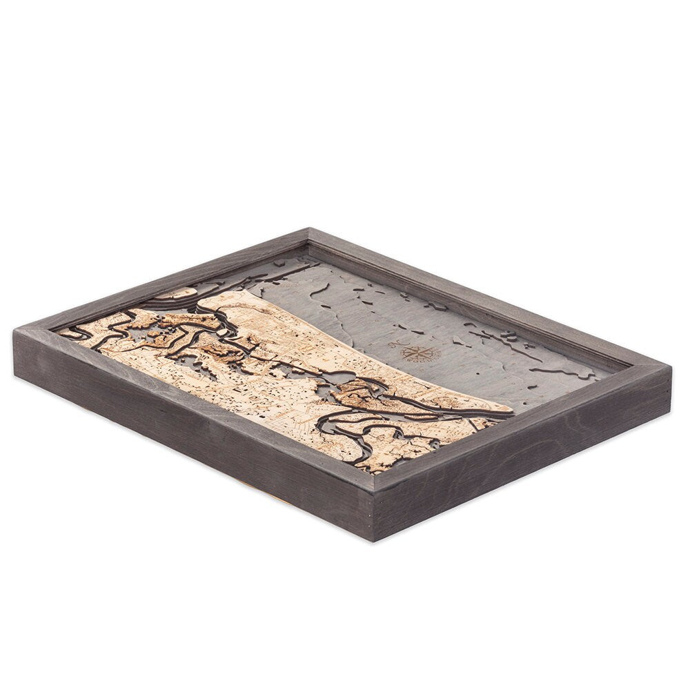 Amelia Island, Florida 3D layered wood map in laser-cut Baltic birch, shown framed against a light wall
