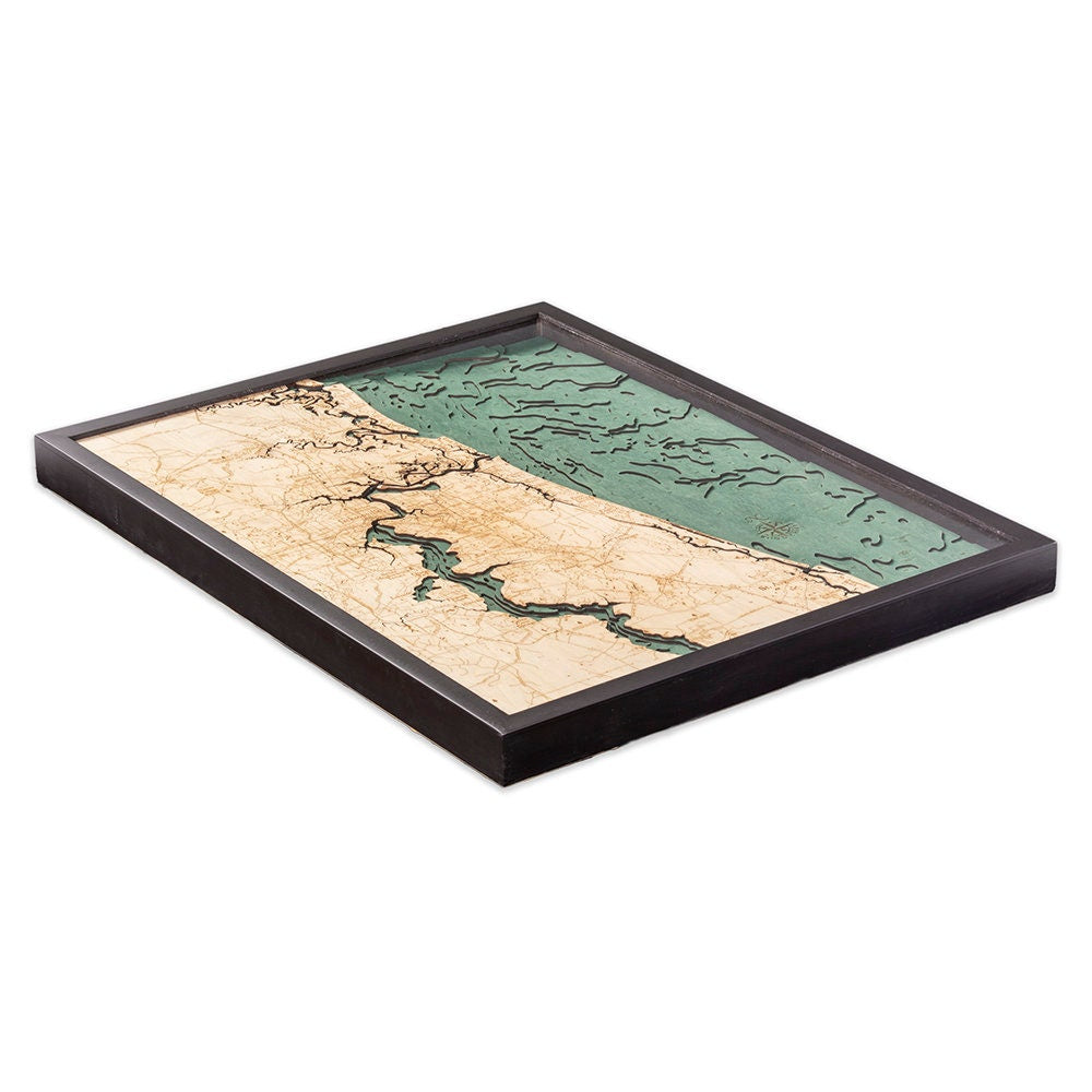 Jacksonville, Florida 3D layered wood map in laser-cut Baltic birch, shown framed against a light wall