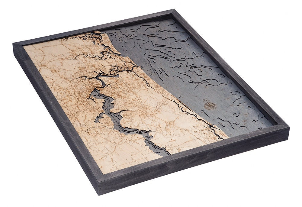 Jacksonville, Florida 3D layered wood map in laser-cut Baltic birch, shown framed against a light wall