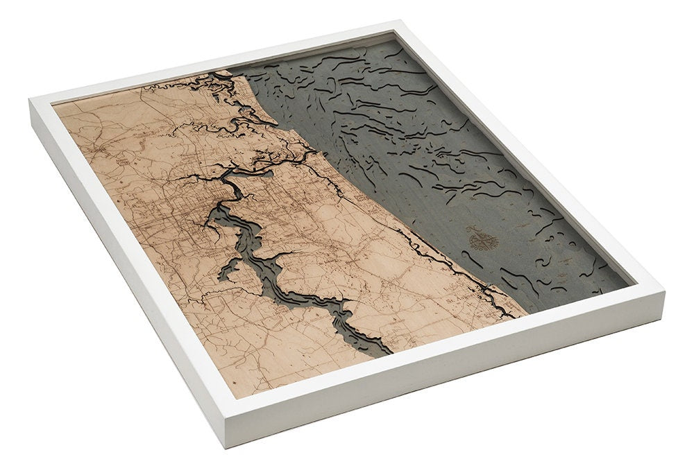 Jacksonville, Florida 3D layered wood map in laser-cut Baltic birch, shown framed against a light wall