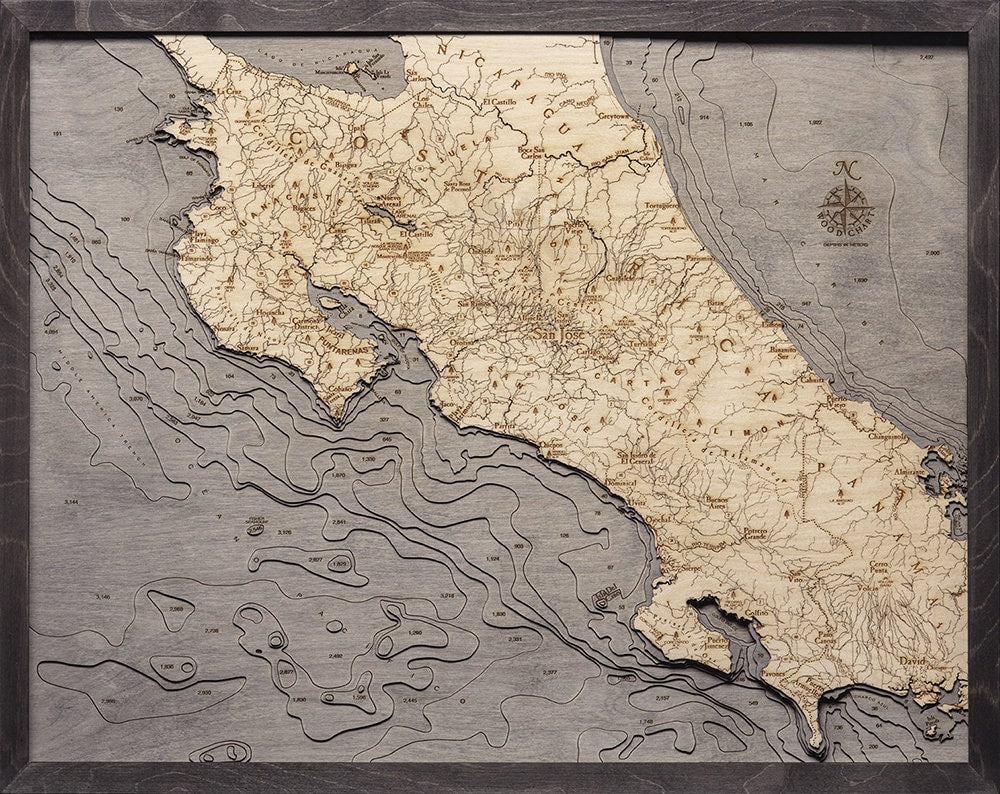 Costa Rica 3D layered wood map in laser-cut Baltic birch, shown framed against a light wall
