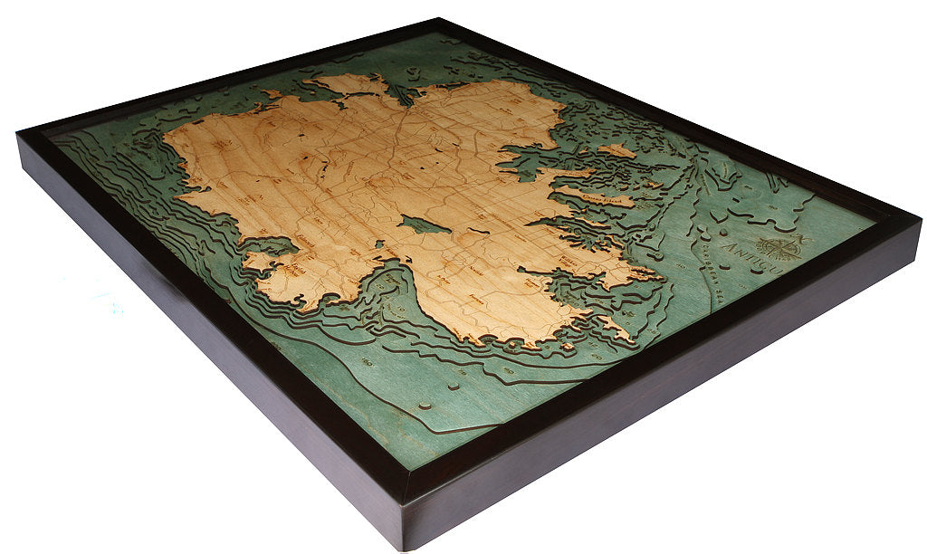 Antigua, Caribbean 3D layered wood map in laser-cut Baltic birch, shown framed against a light wall