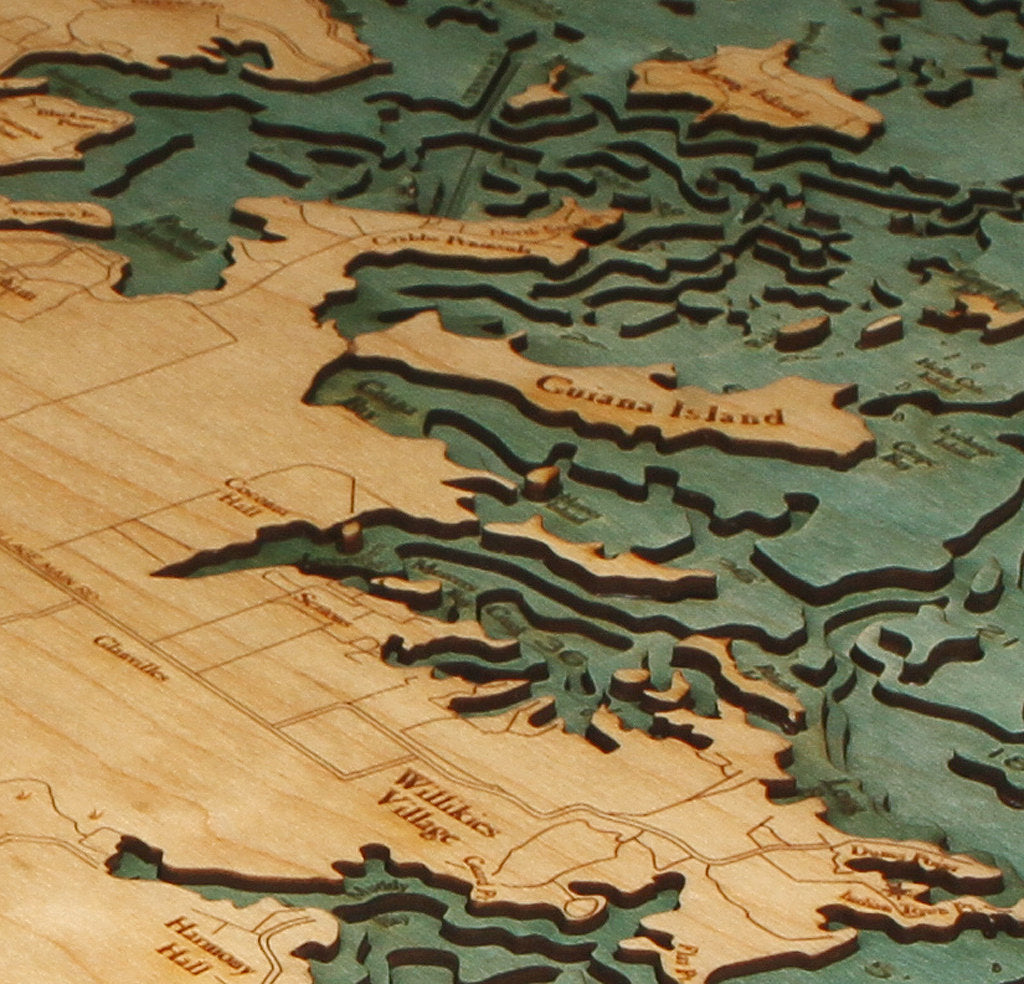 Antigua, Caribbean 3D layered wood map in laser-cut Baltic birch, shown framed against a light wall