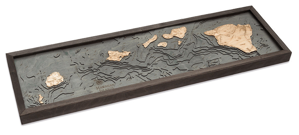 Hawaiian Islands 3D layered wood map in laser-cut Baltic birch, shown framed against a light wall