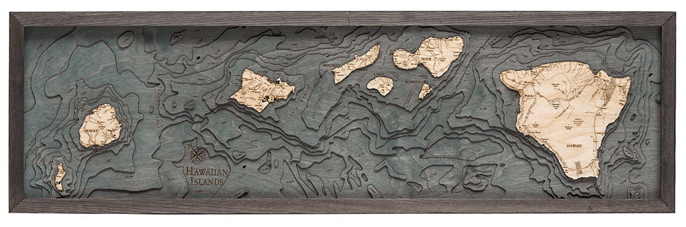 Hawaiian Islands 3D layered wood map in laser-cut Baltic birch, shown framed against a light wall