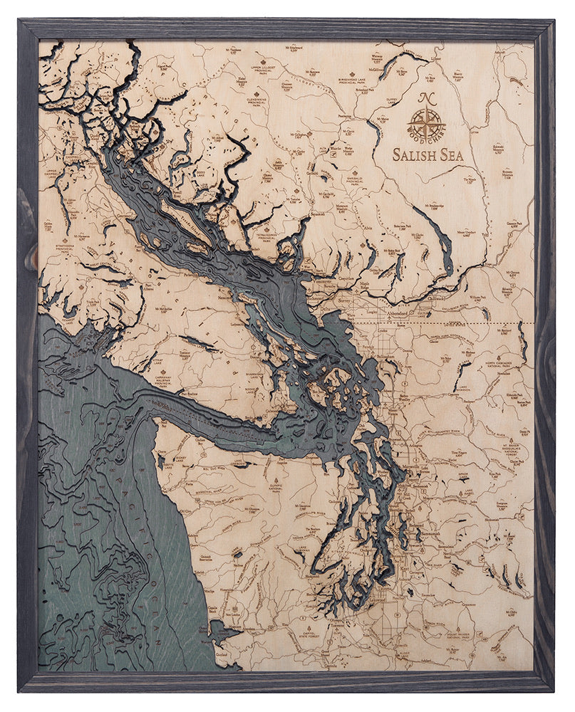 Salish Sea, Washington 3D layered wood map in laser-cut Baltic birch, shown framed against a light wall