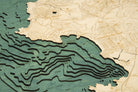 Carmel & Monterey, California 3D layered wood map in laser-cut Baltic birch, shown framed against a light wall