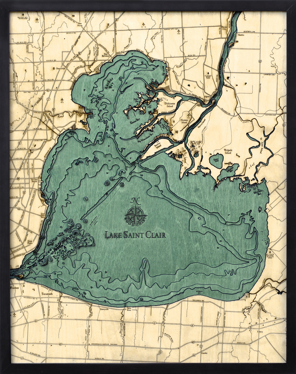Lake St. Clair, Michigan 3D layered wood map in laser-cut Baltic birch, shown framed against a light wall