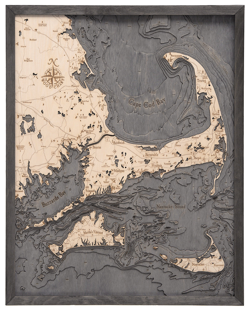 Cape Cod, Massachusetts 3D layered wood map in laser-cut Baltic birch, shown framed against a light wall