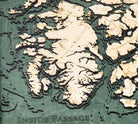 Inside Passage, Alaska 3D layered wood map in laser-cut Baltic birch, shown framed against a light wall