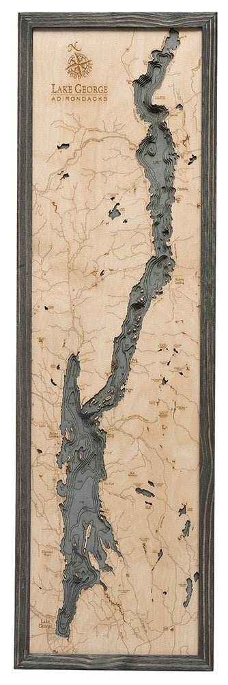 Lake George, New York 3D layered wood map in laser-cut Baltic birch, shown framed against a light wall