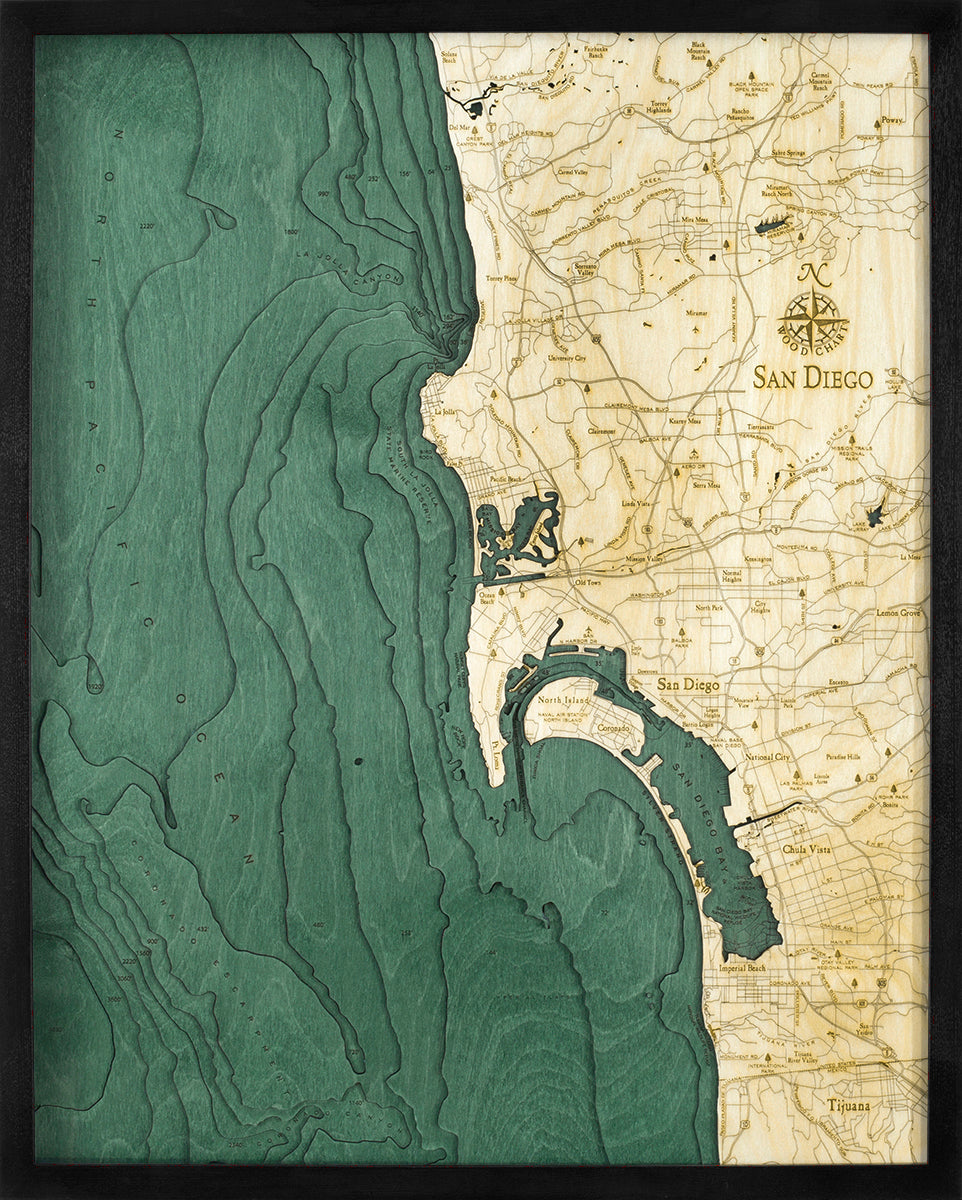 San Diego, California 3D layered wood map in laser-cut Baltic birch, shown framed against a light wall
