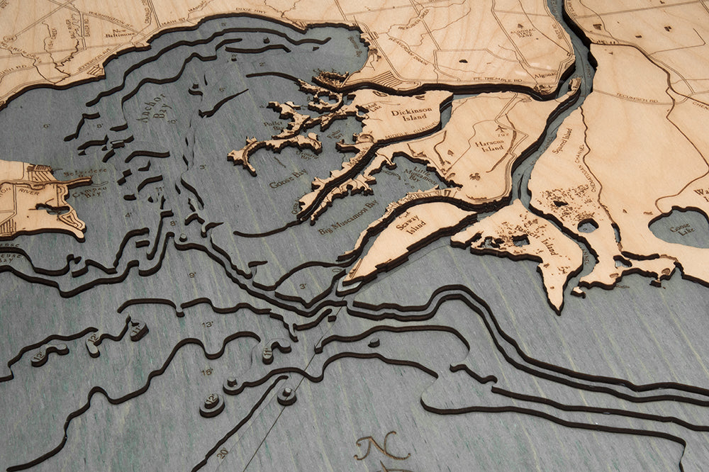 Lake St. Clair, Michigan 3D layered wood map in laser-cut Baltic birch, shown framed against a light wall
