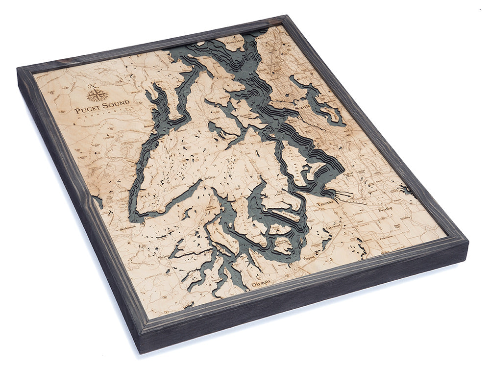 Puget Sound, Washington 3D layered wood map in laser-cut Baltic birch, shown framed against a light wall