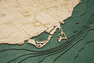 Toronto, Ontario 3D layered wood map in laser-cut Baltic birch, shown framed against a light wall