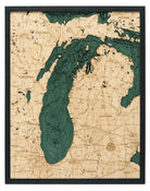 Lake Michigan 3D layered wood map in laser-cut Baltic birch, shown framed against a light wall