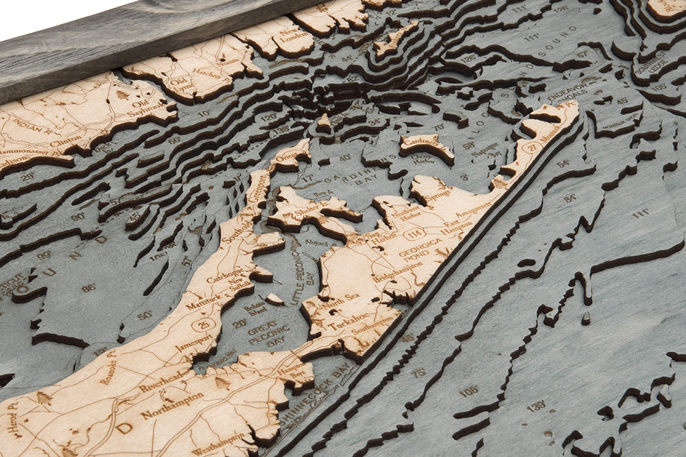 Long Island Sound 3D layered wood map in laser-cut Baltic birch, shown framed against a light wall