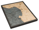 Monterey Bay, California 3D layered wood map in laser-cut Baltic birch, shown framed against a light wall