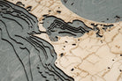Block Island, Rhode Island 3D layered wood map in laser-cut Baltic birch, shown framed against a light wall