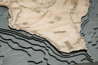 Hawaiian Islands 3D layered wood map in laser-cut Baltic birch, shown framed against a light wall