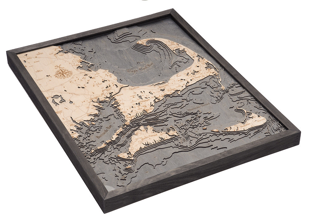 Cape Cod, Massachusetts 3D layered wood map in laser-cut Baltic birch, shown framed against a light wall