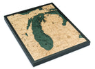 Lake Michigan 3D layered wood map in laser-cut Baltic birch, shown framed against a light wall