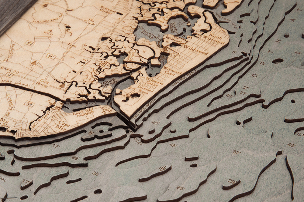 New Jersey South Shore 3D layered wood map in laser-cut Baltic birch, shown framed against a light wall