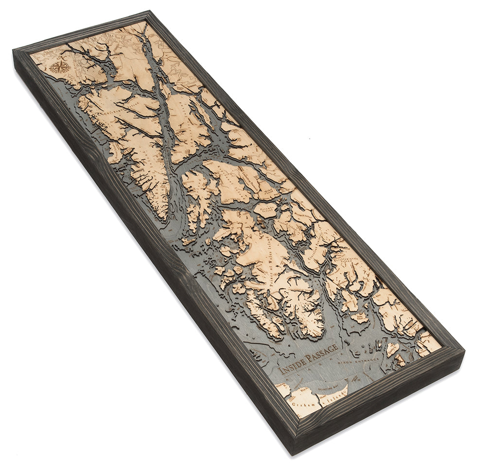 Inside Passage, Alaska 3D layered wood map in laser-cut Baltic birch, shown framed against a light wall