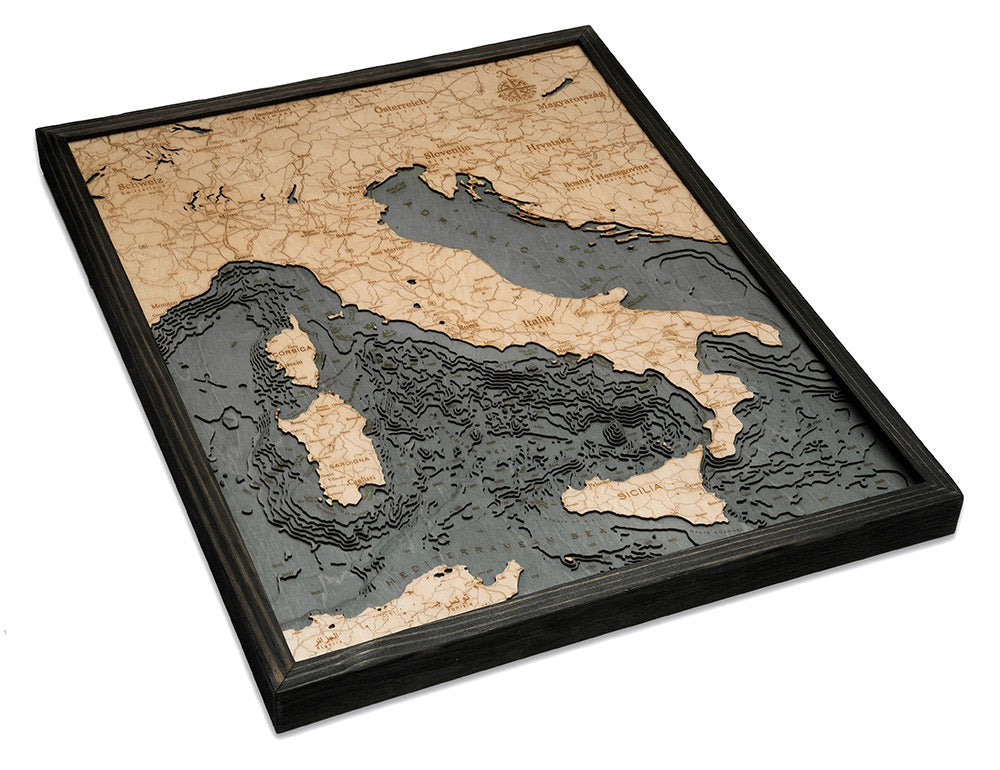 Italy 3D layered wood map in laser-cut Baltic birch, shown framed against a light wall