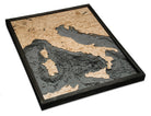 Italy 3D layered wood map in laser-cut Baltic birch, shown framed against a light wall
