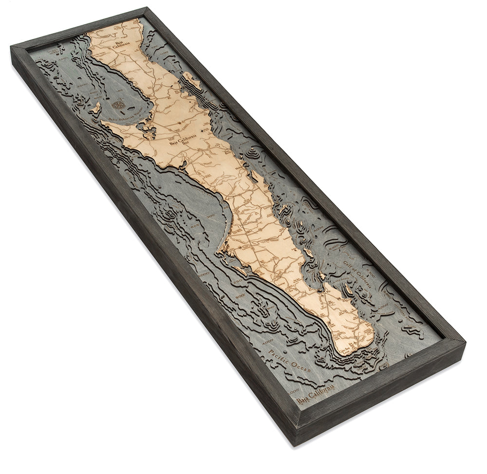 Baja California, Mexico 3D layered wood map in laser-cut Baltic birch, shown framed against a light wall